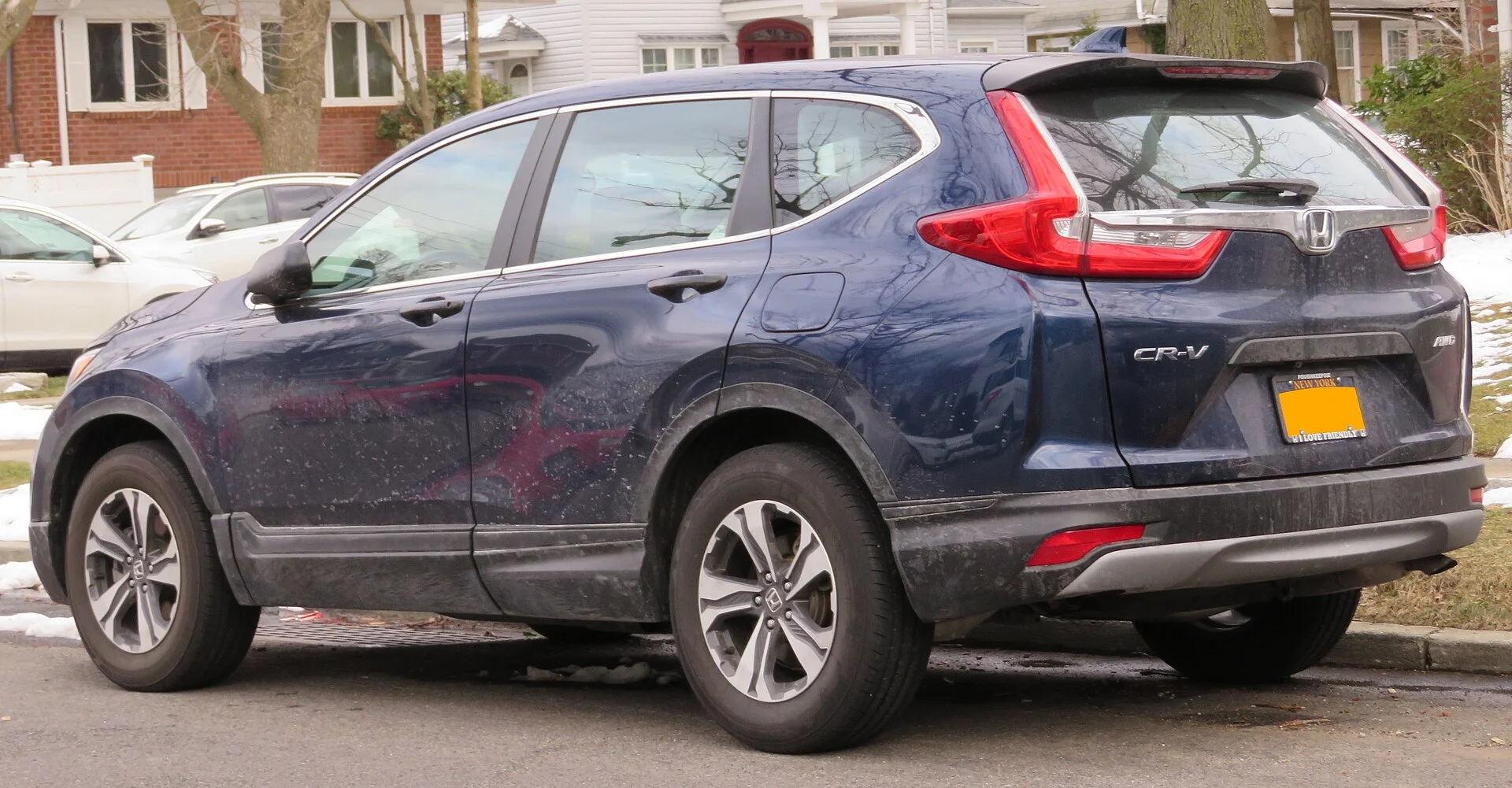 Honda CR-V (2017, 5th generation) in dark blue, rear three-quarter view