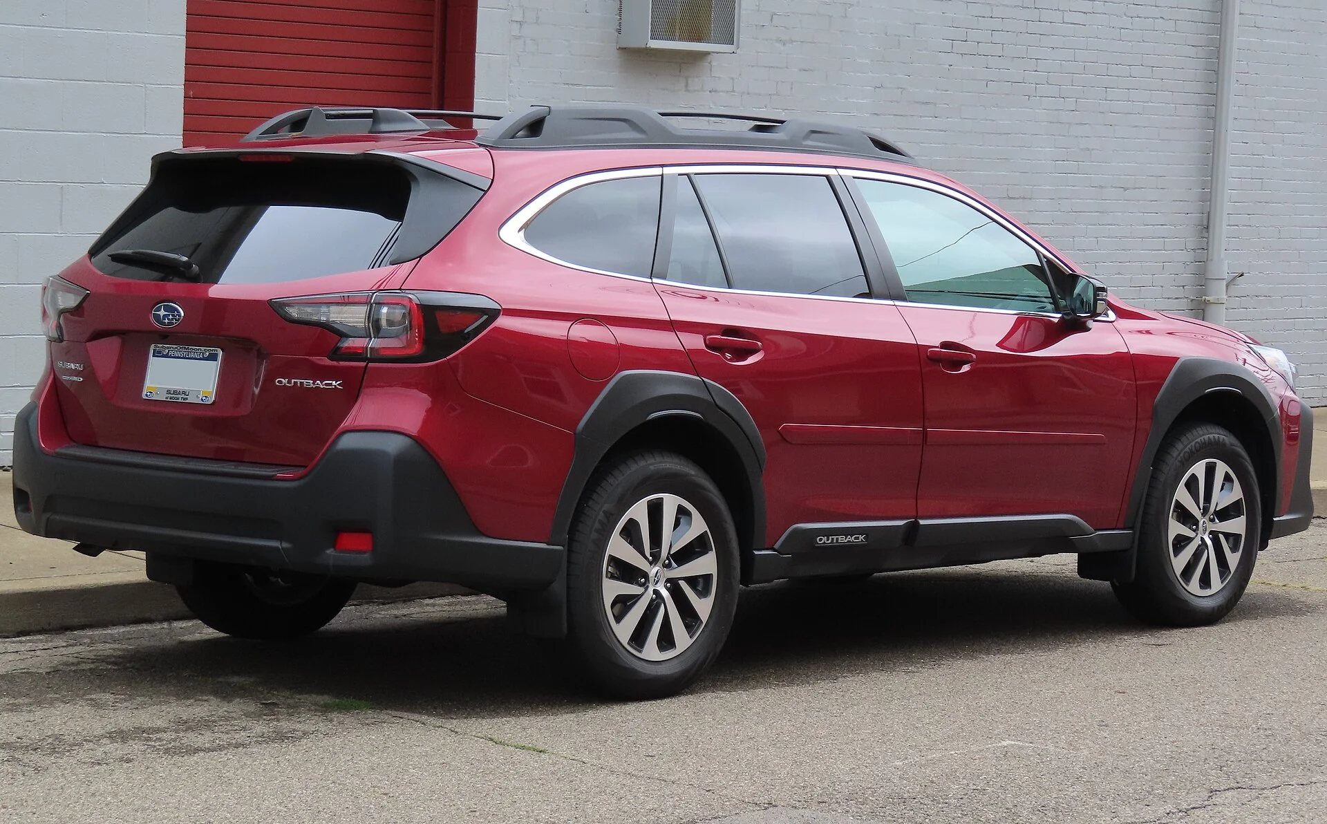 Red Subaru Outback, current generation, side view
