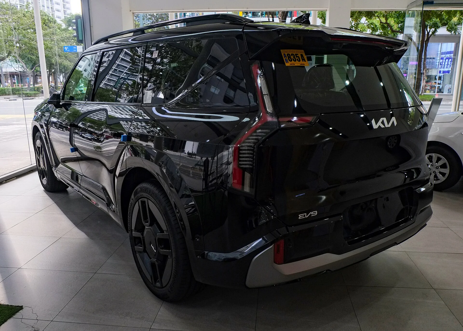 Black Kia EV9, rear three-quarter view