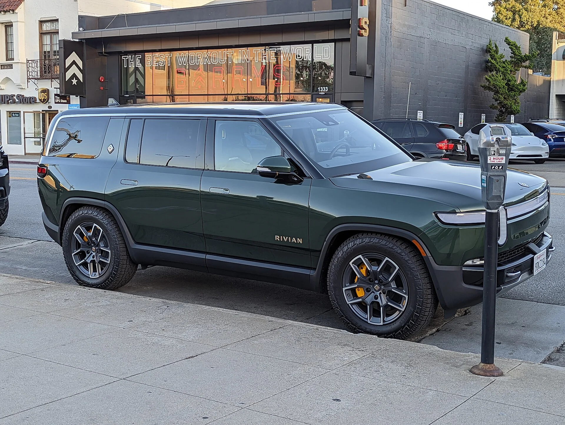 Rivian R1S in Forest Green, side profile
