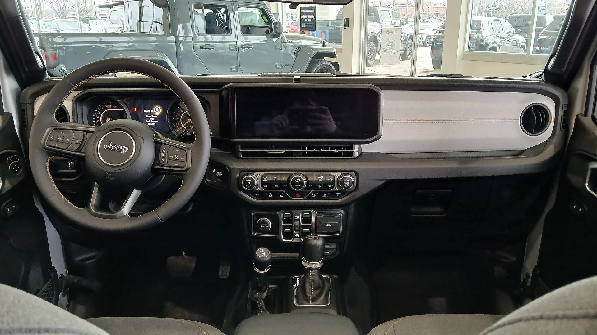 2024 Jeep Wrangler (JL) dashboard and center stack, where the 12V and USB power outlets sit