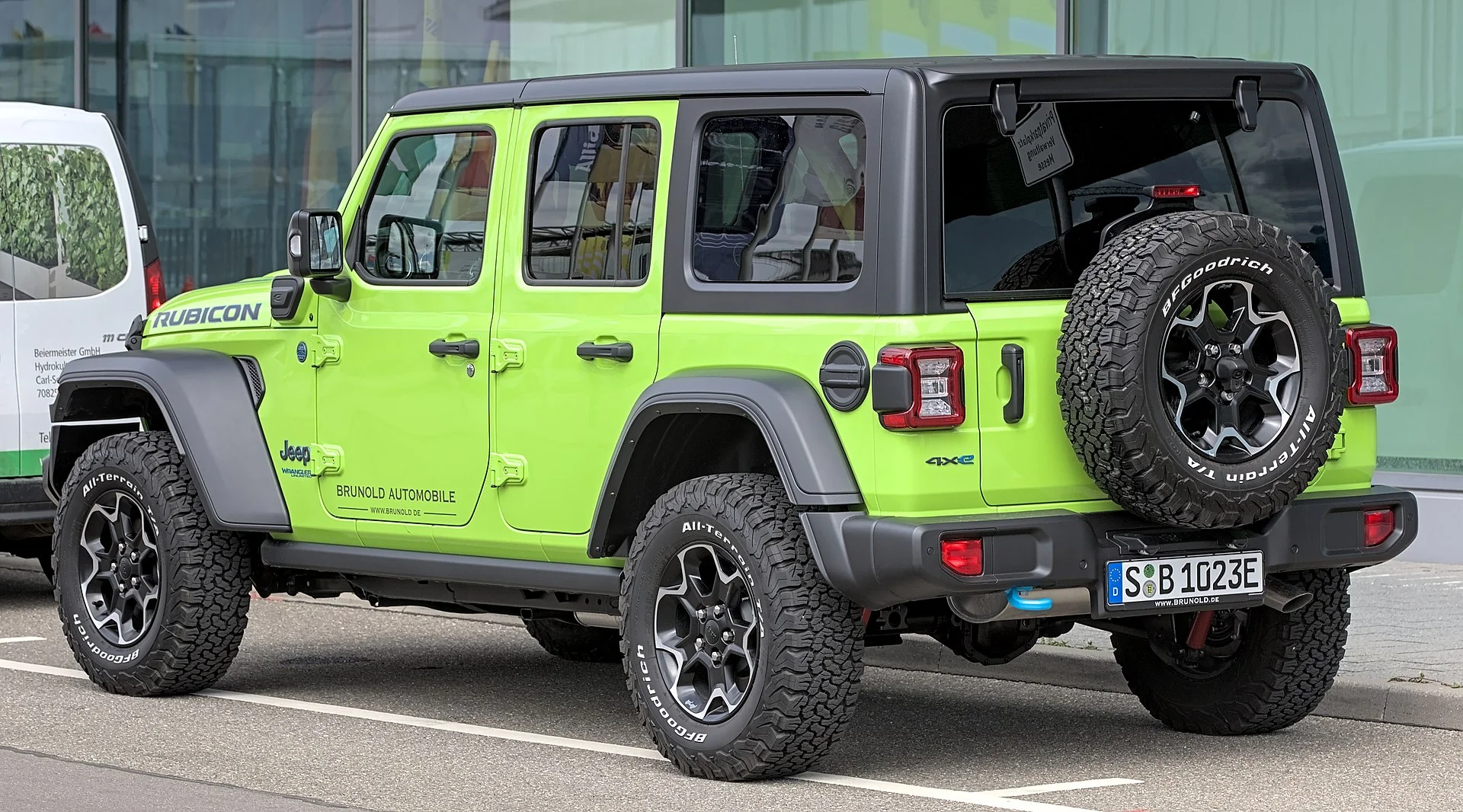 Jeep Wrangler Unlimited (JL) rear three-quarter, showing the tailgate and rear cargo area near the rear power outlet