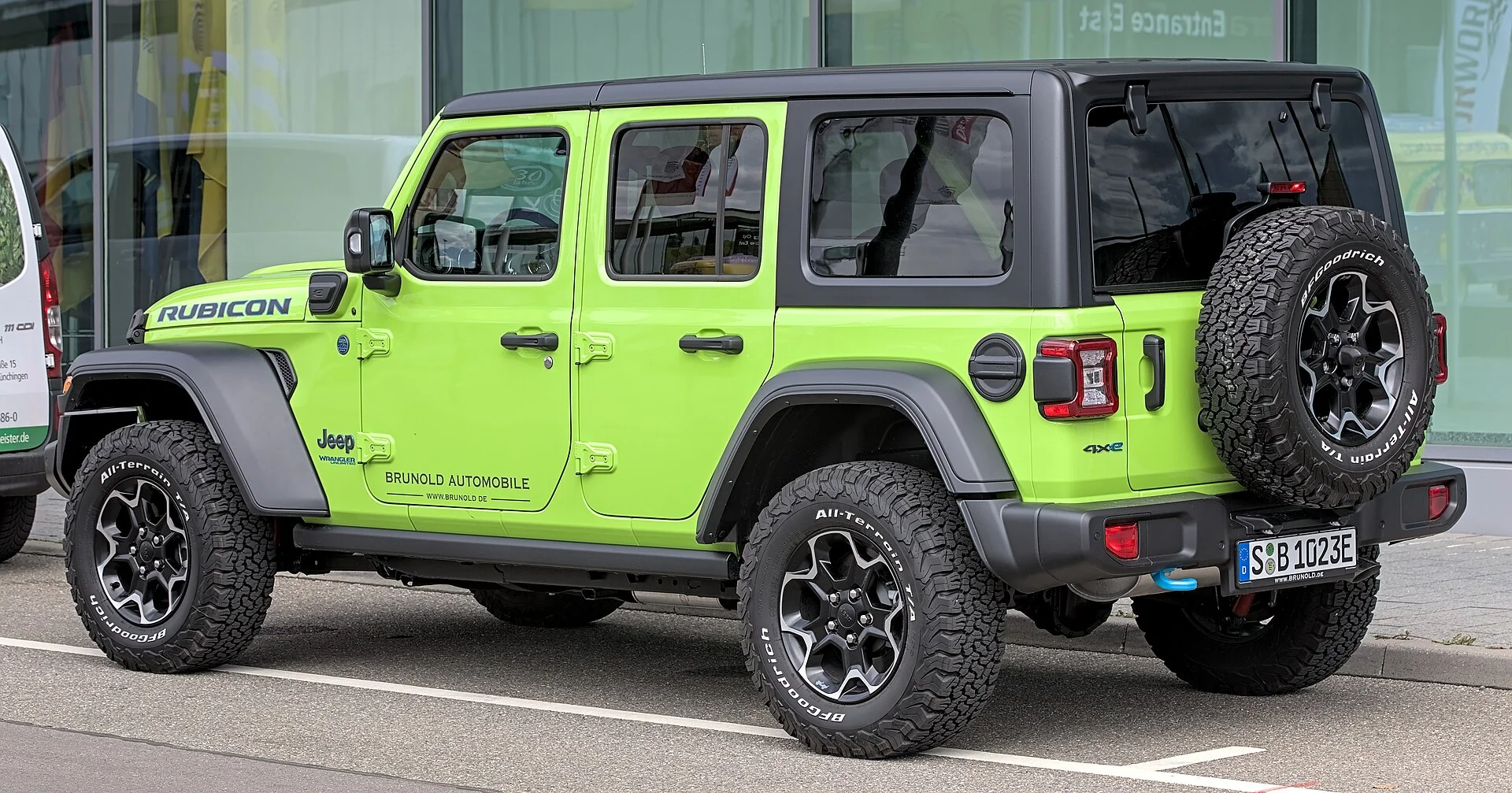 Jeep Wrangler Rubicon 4xe — a green Wrangler, side profile (an awning mounts along the roof-rack line on this side)