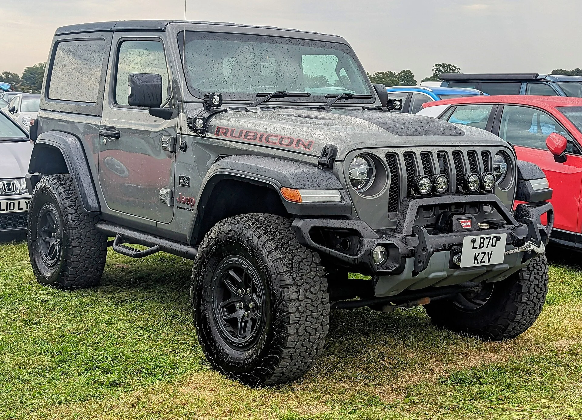 Jeep Wrangler Rubicon Unlimited — a silver 2020 Wrangler with an aftermarket front bumper, front three-quarter view