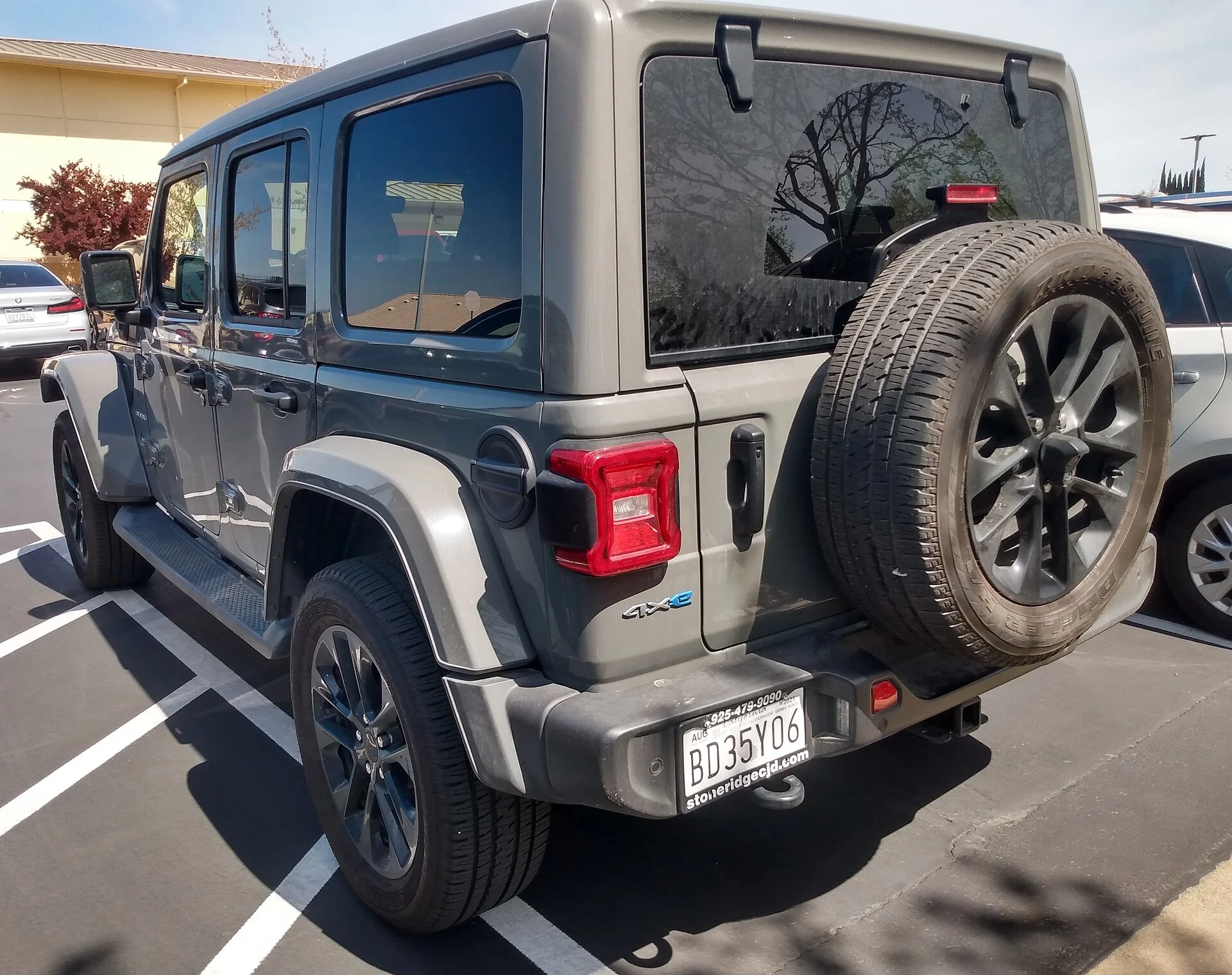 Jeep Wrangler Unlimited Sahara 4xe — a 2022 Wrangler, rear view with spare tire