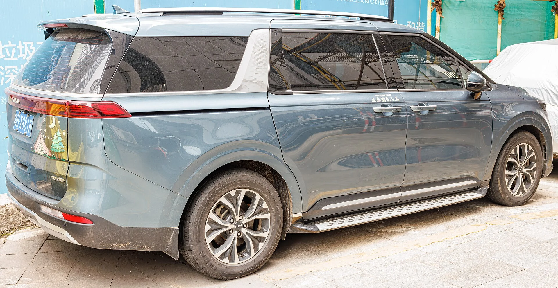 Kia Carnival (KA4) rear three-quarter, the tailgate and cargo bay you sleep in
