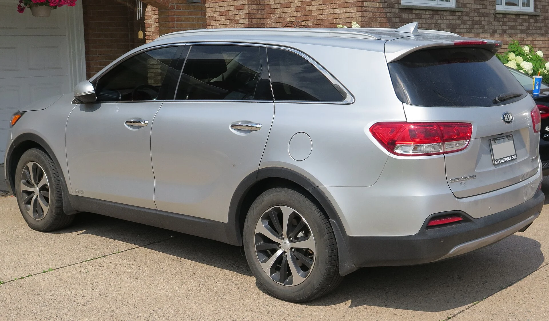 An earlier-generation Kia Sorento mid-size SUV (side profile); the current Sorento carries the same three-row layout this camping setup guide covers.