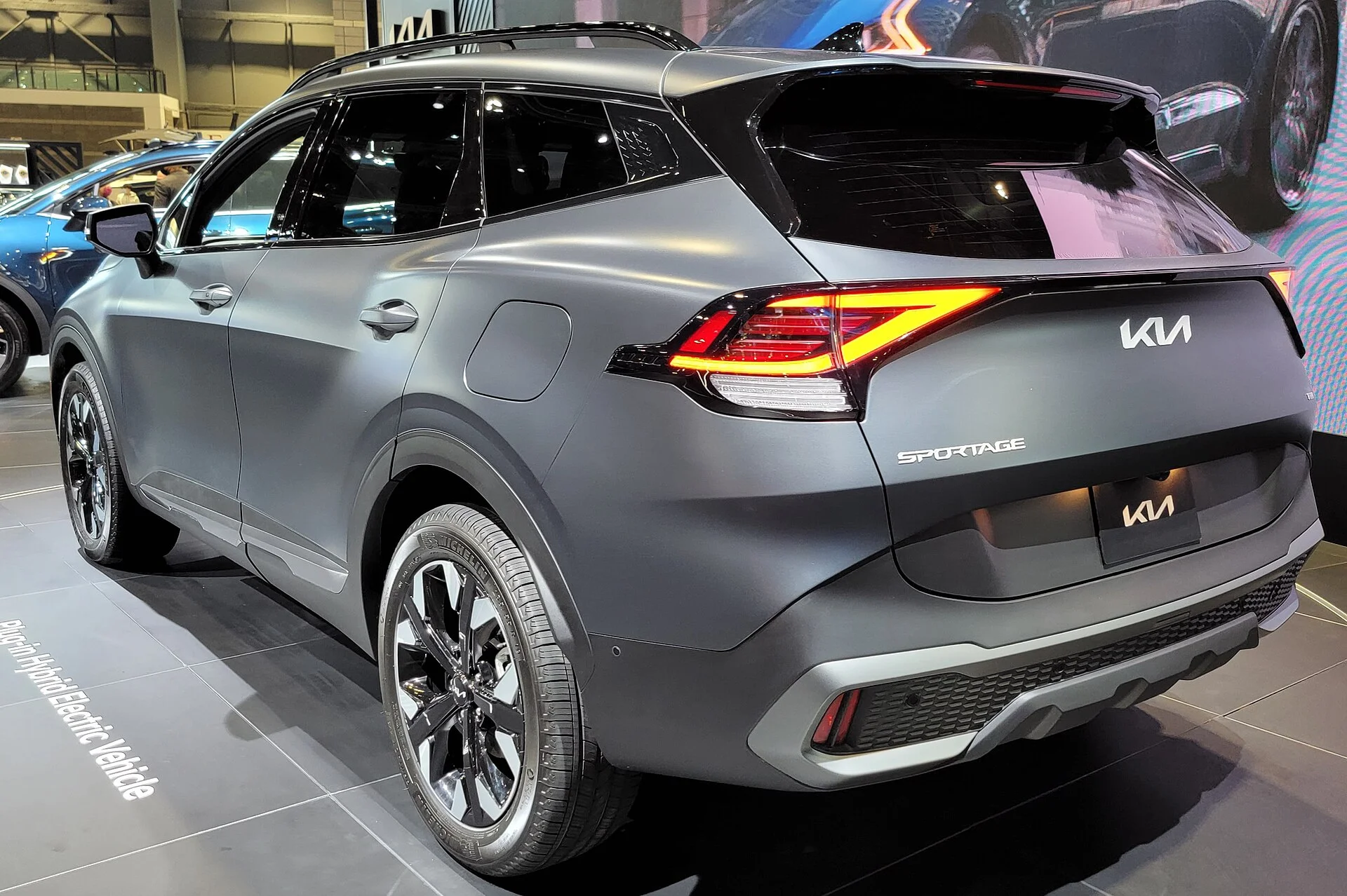 Silver Kia Sportage rear three-quarter view (2023)