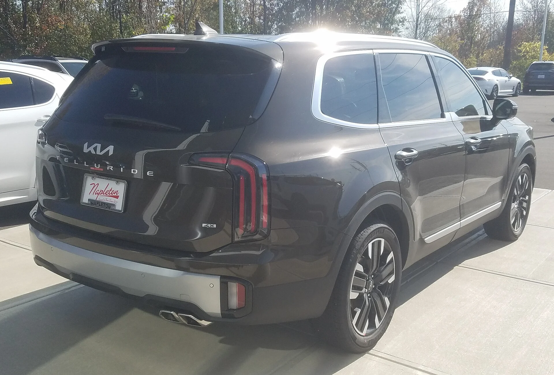 Kia Telluride — a black 2023 Telluride, rear three-quarter view