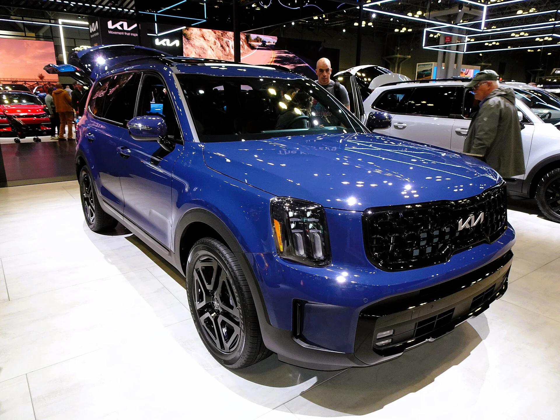 Blue 2024 Kia Telluride SX-Prestige X-Line SUV with roof rails, front three-quarter view
