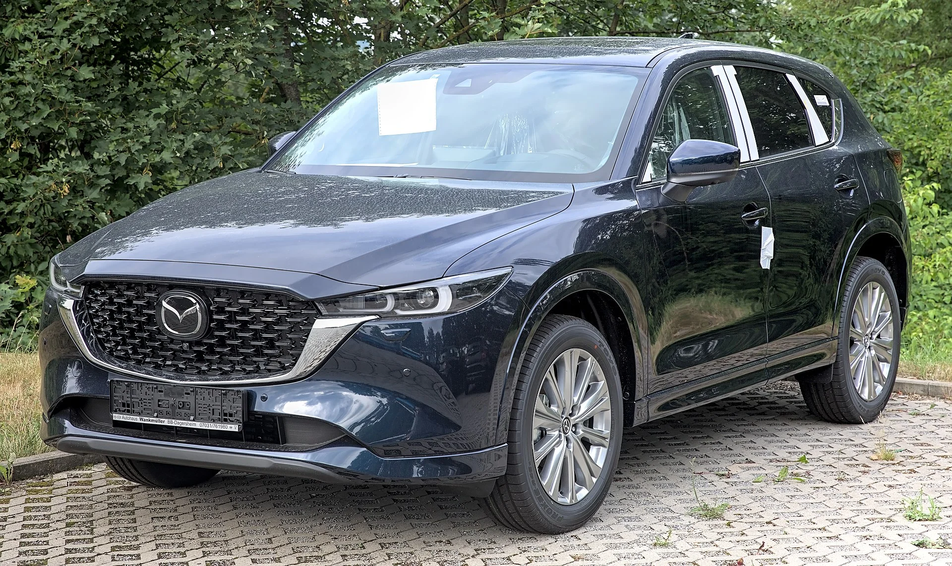 Mazda CX-5 (KF) in dark grey, front three-quarter view