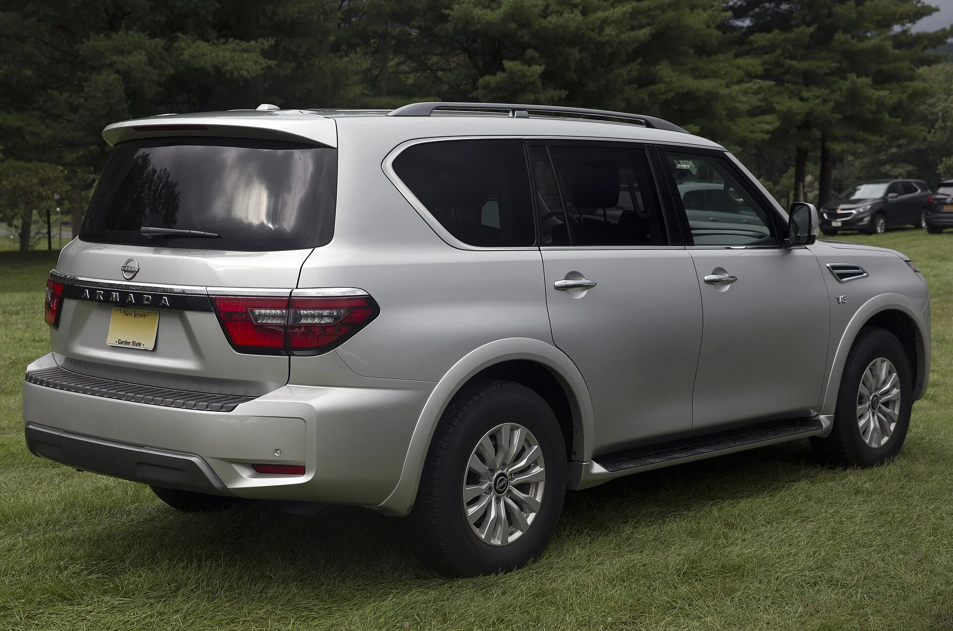 Nissan Armada SV — a silver 2021 Armada 2WD, rear three-quarter view