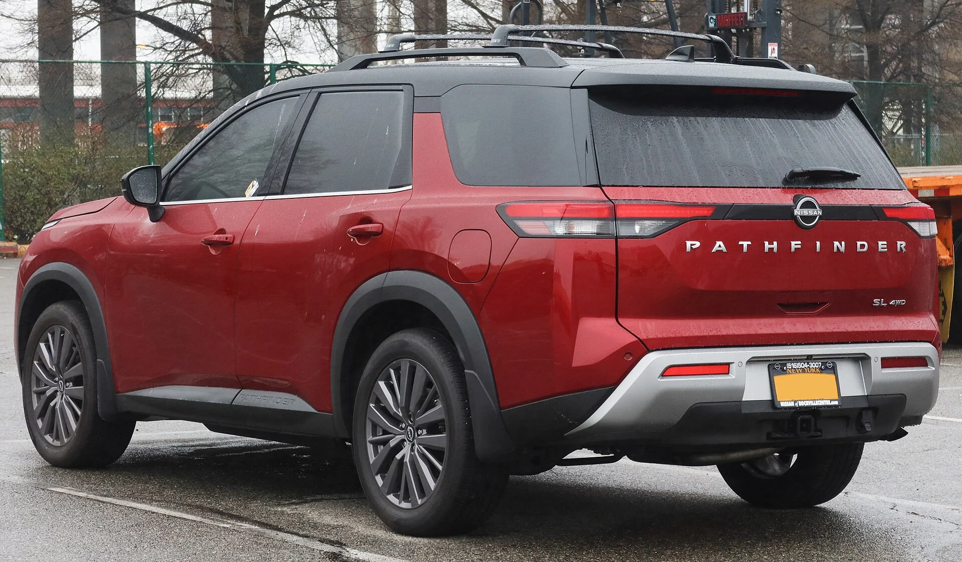 Nissan Pathfinder SL — a red 2023 Pathfinder, rear three-quarter view