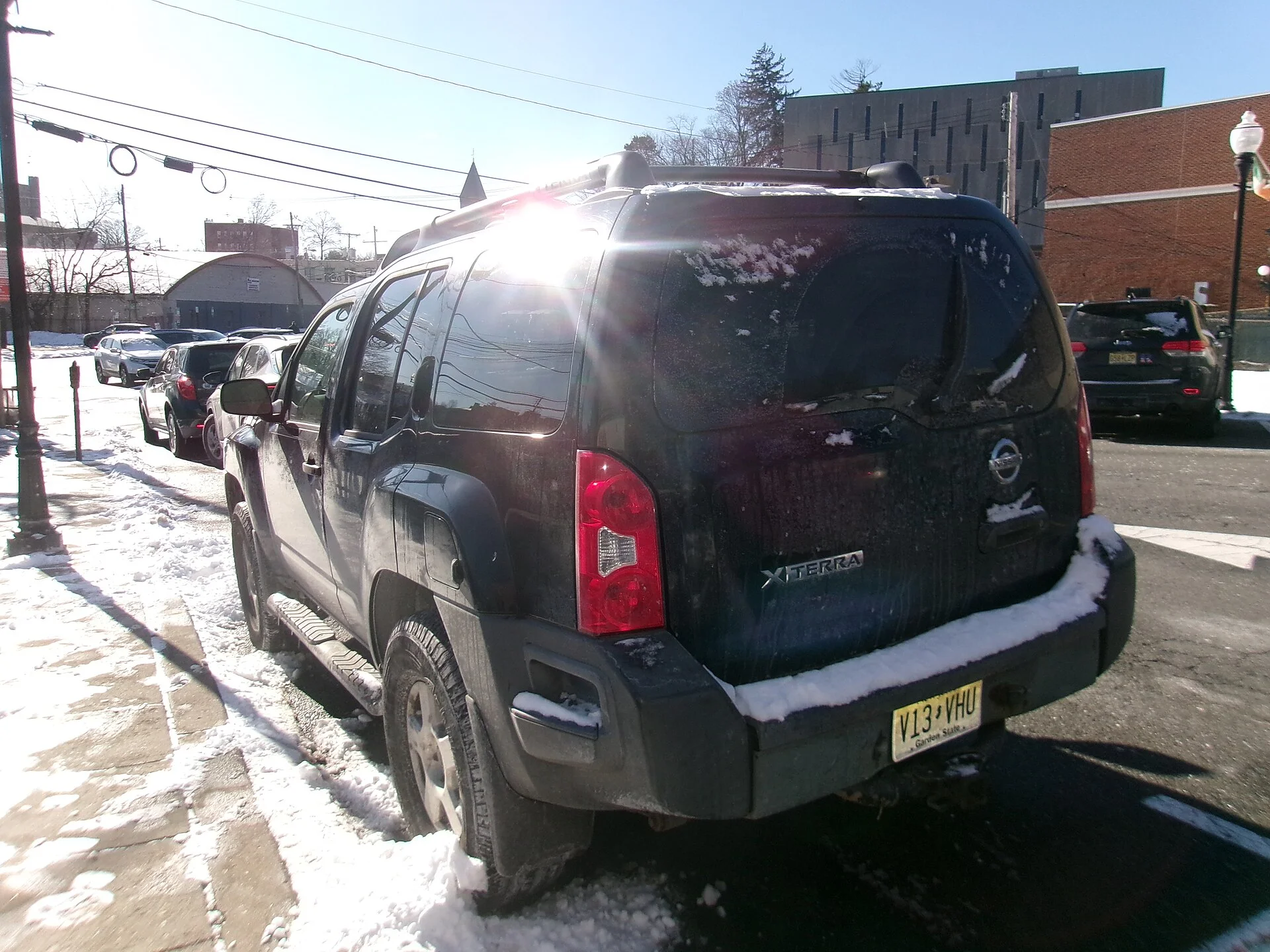 Nissan Xterra — a black 2008 Xterra, rear and side three-quarter view