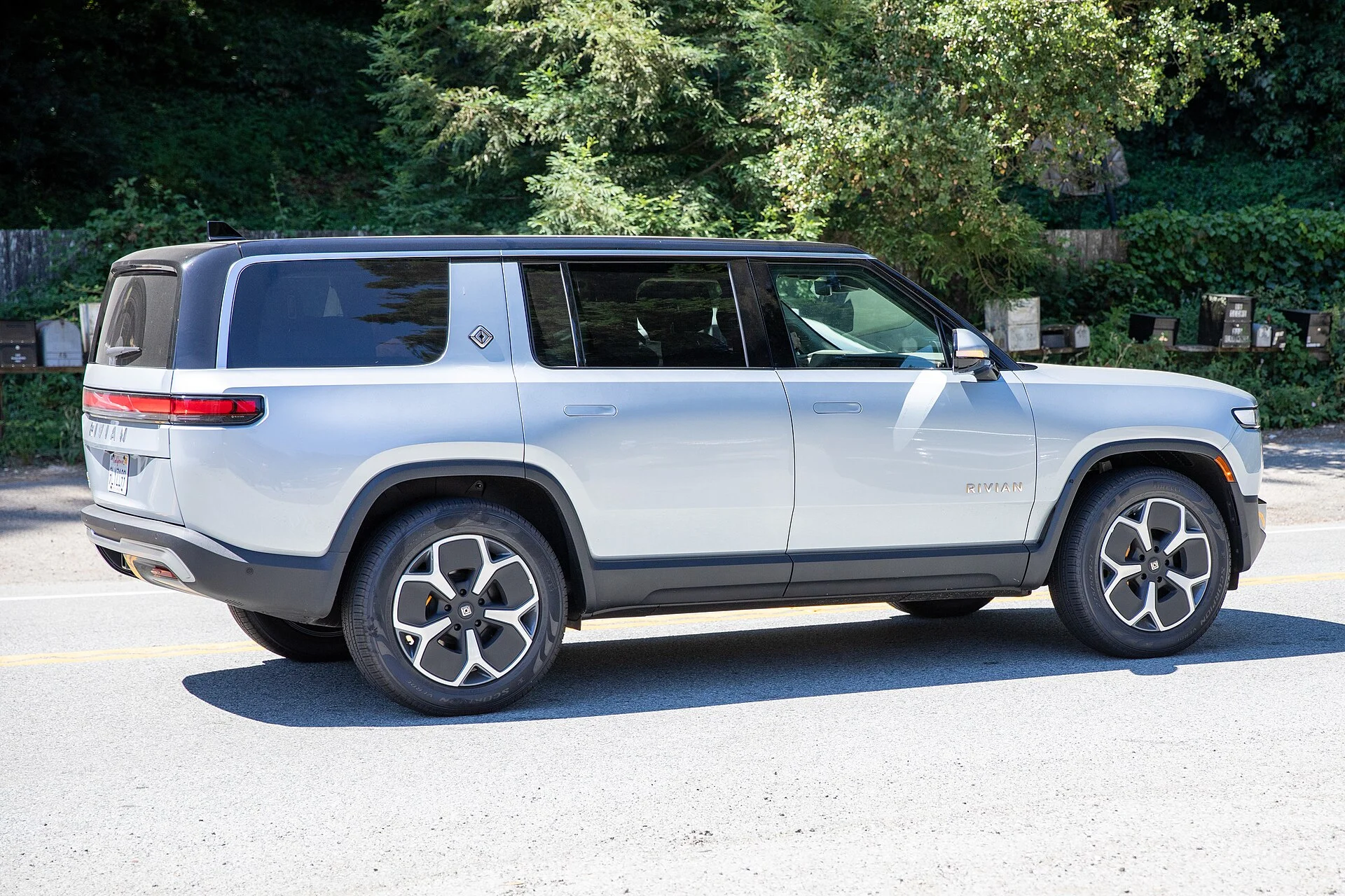 Yellow Rivian R1S electric SUV, side profile