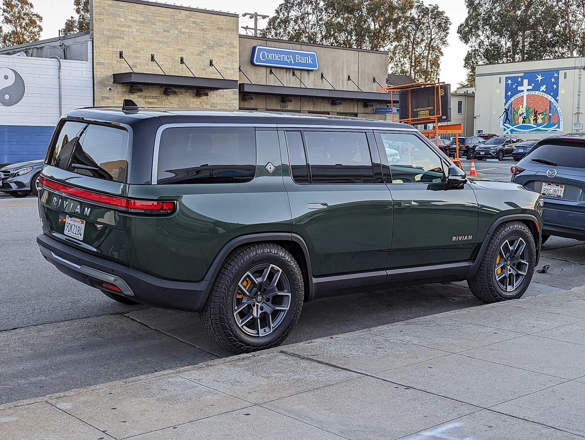 Green Rivian R1S electric SUV, side profile