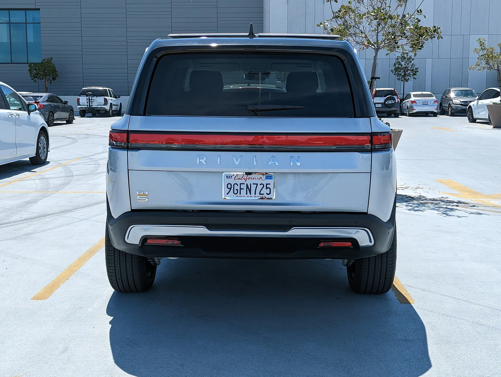 Silver Rivian R1S electric SUV, rear view