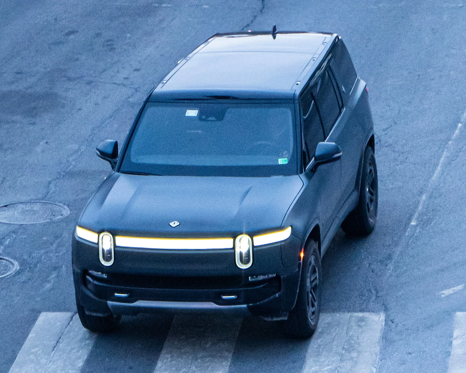 Dark grey Rivian R1S electric SUV, front