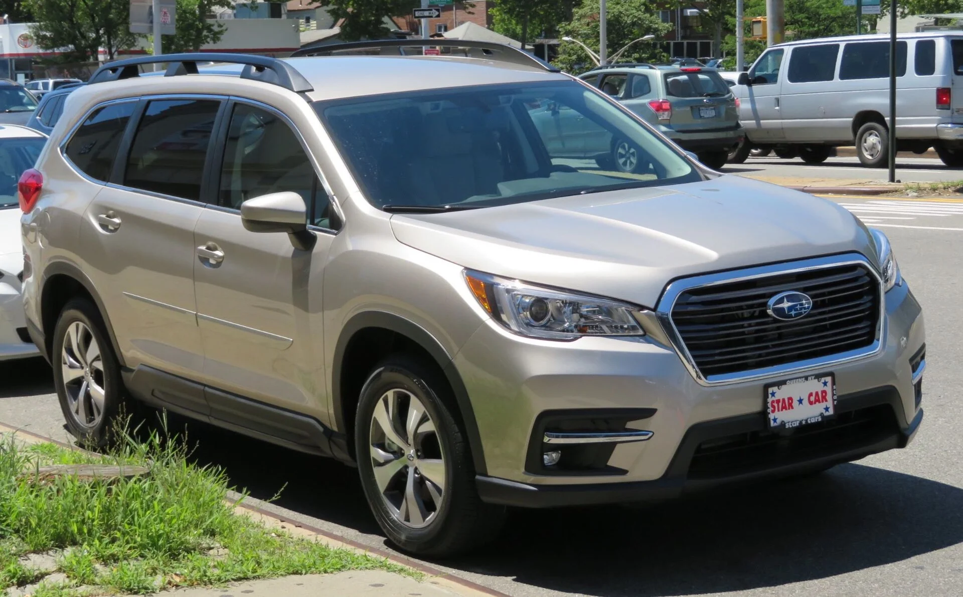 Champagne-gold 2019 Subaru Ascent SUV with roof rails, front three-quarter view