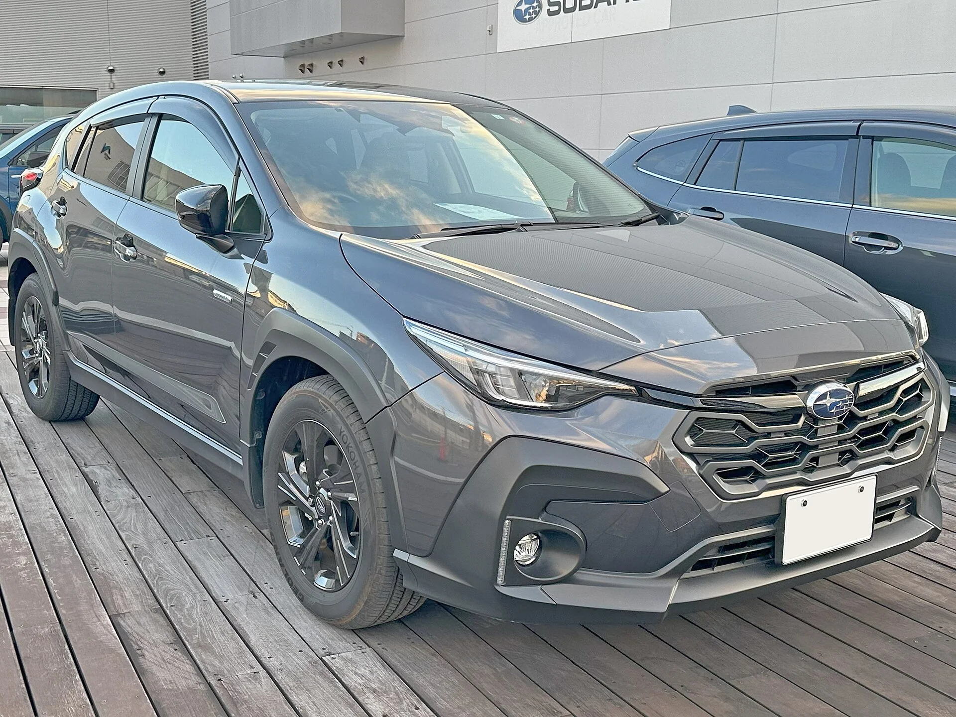 A Subaru Crosstrek Touring (front view) in grey, the current-generation crossover this camping guide evaluates.