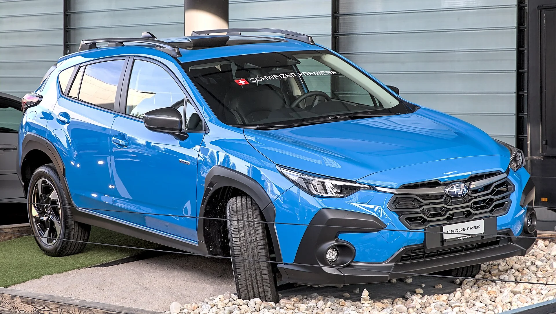 Blue Subaru Crosstrek, current generation, front three-quarter view