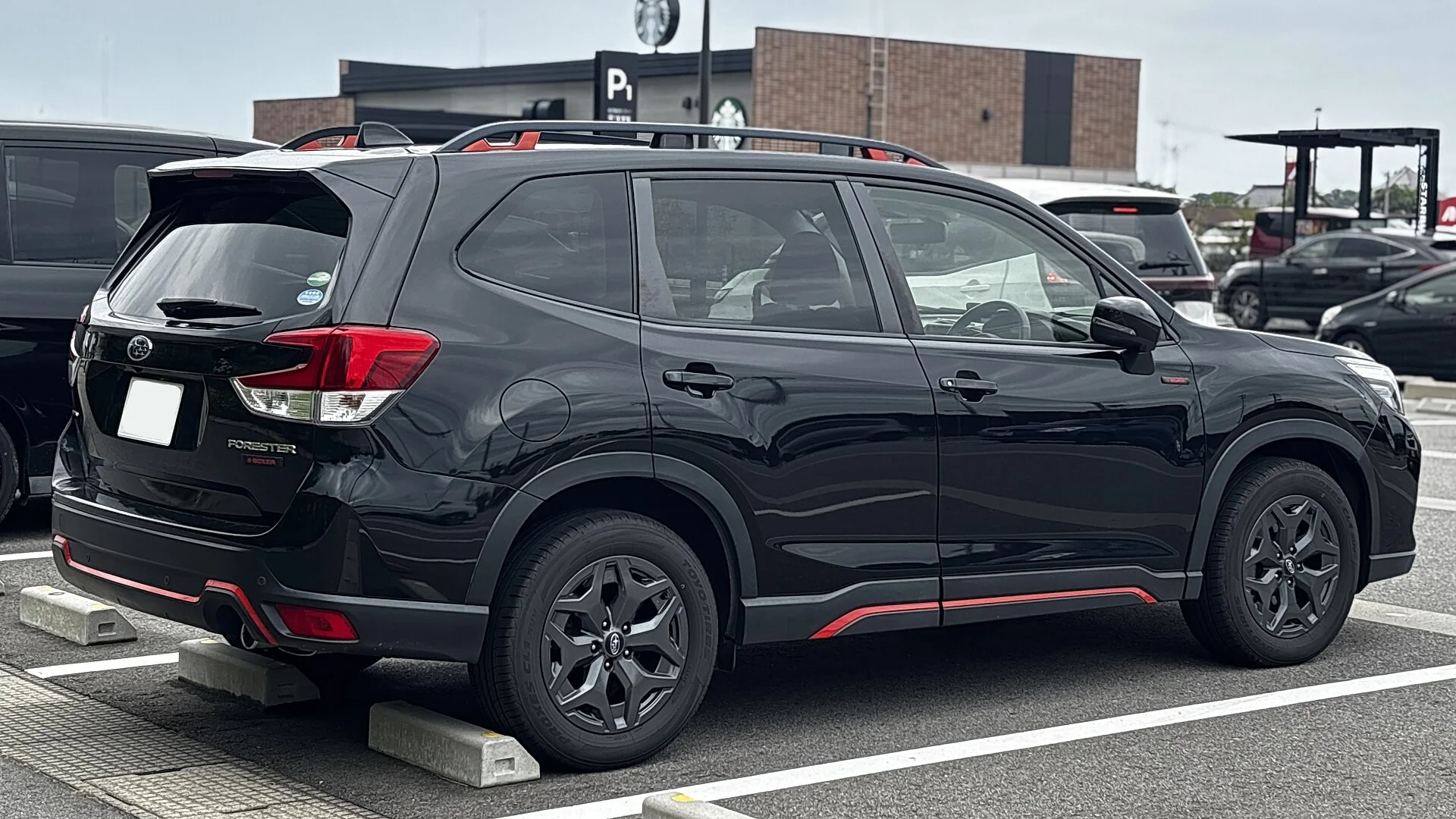 Subaru Forester e-BOXER X-BREAK — a black 2021 Forester, rear three-quarter view