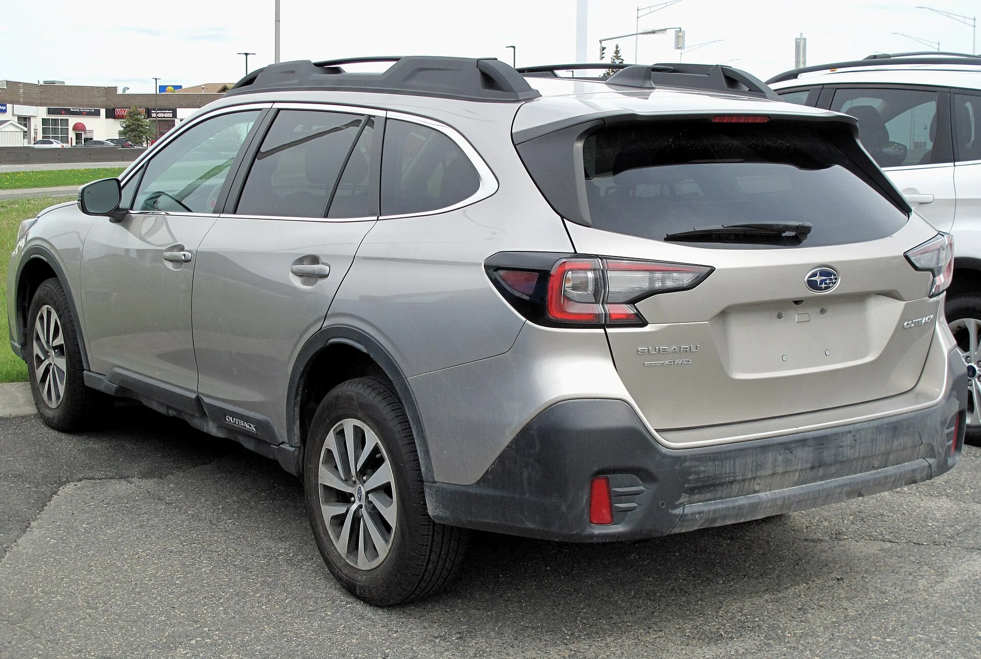 Subaru Outback Touring — a silver 2020 Outback, rear and side three-quarter view (the rear where a hitch receiver mounts)