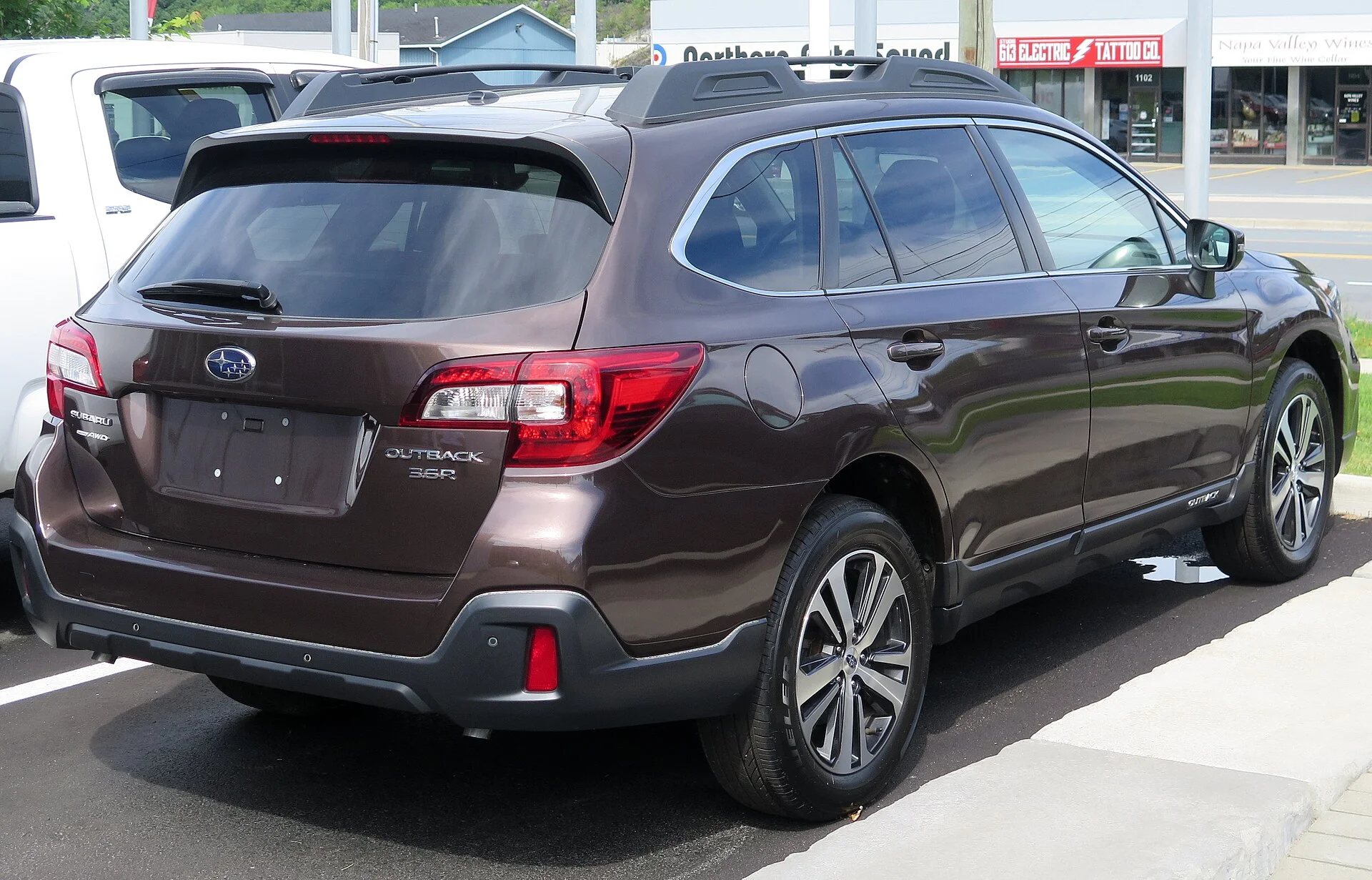 Subaru Outback 3.6R Limited — a brown 2019 (previous-generation) Outback, rear three-quarter view