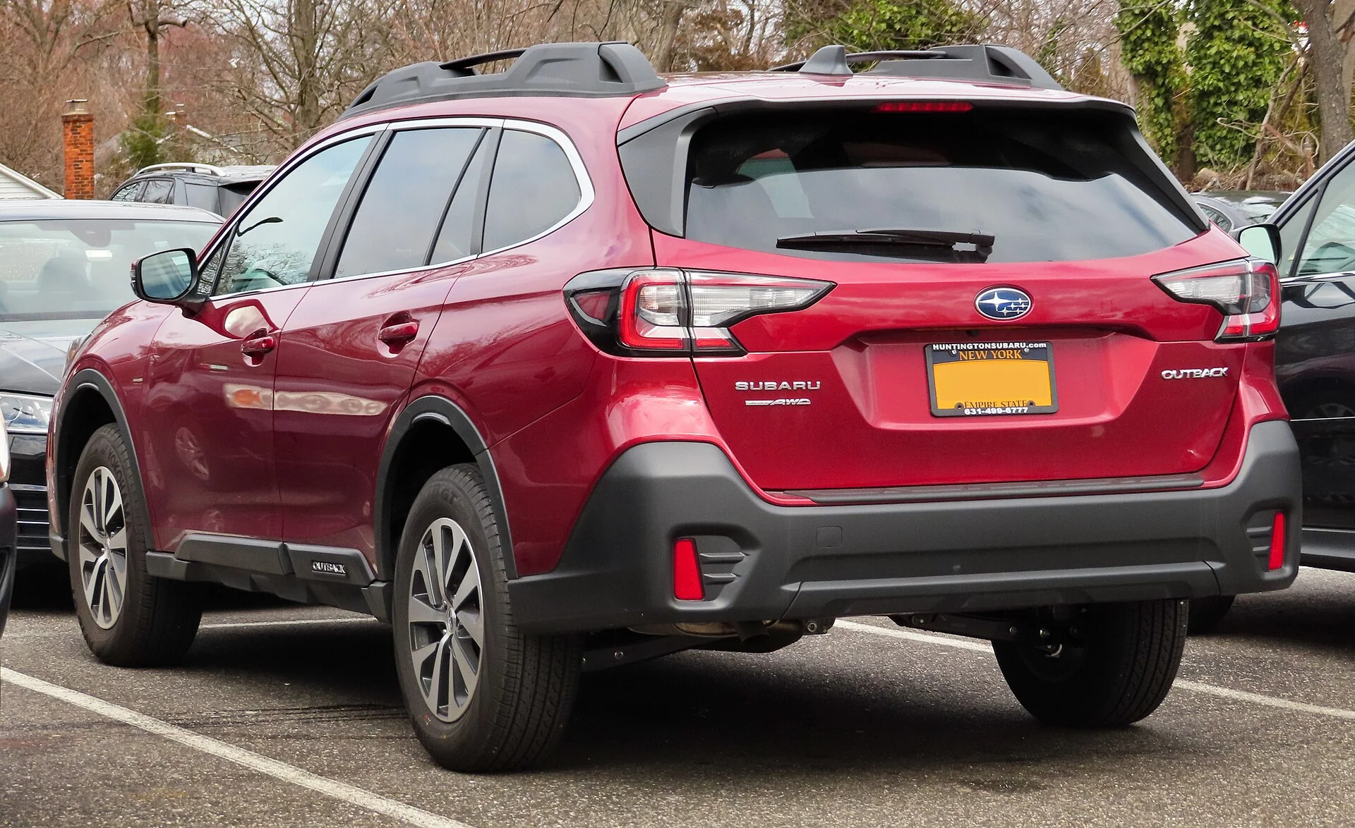 Subaru Outback Premium — a red 2020 Outback, rear three-quarter view