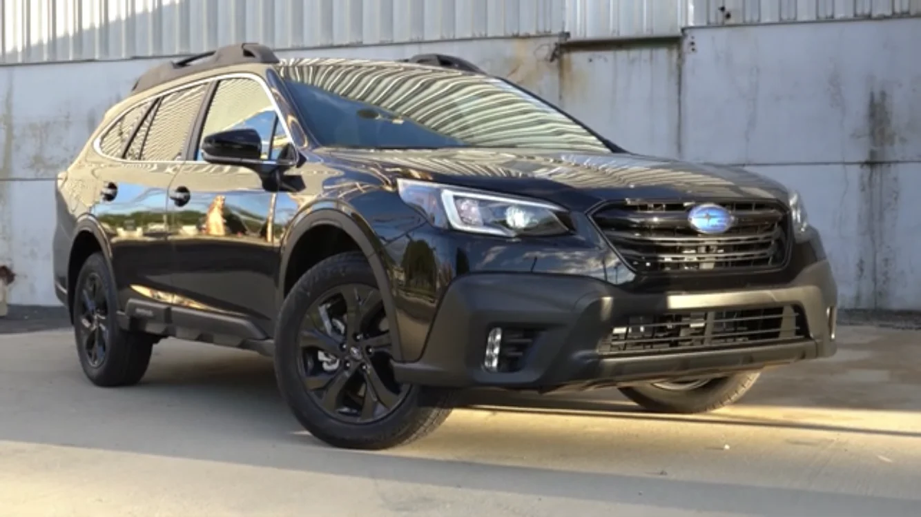 Subaru Outback — a black 2021 Outback, front three-quarter view