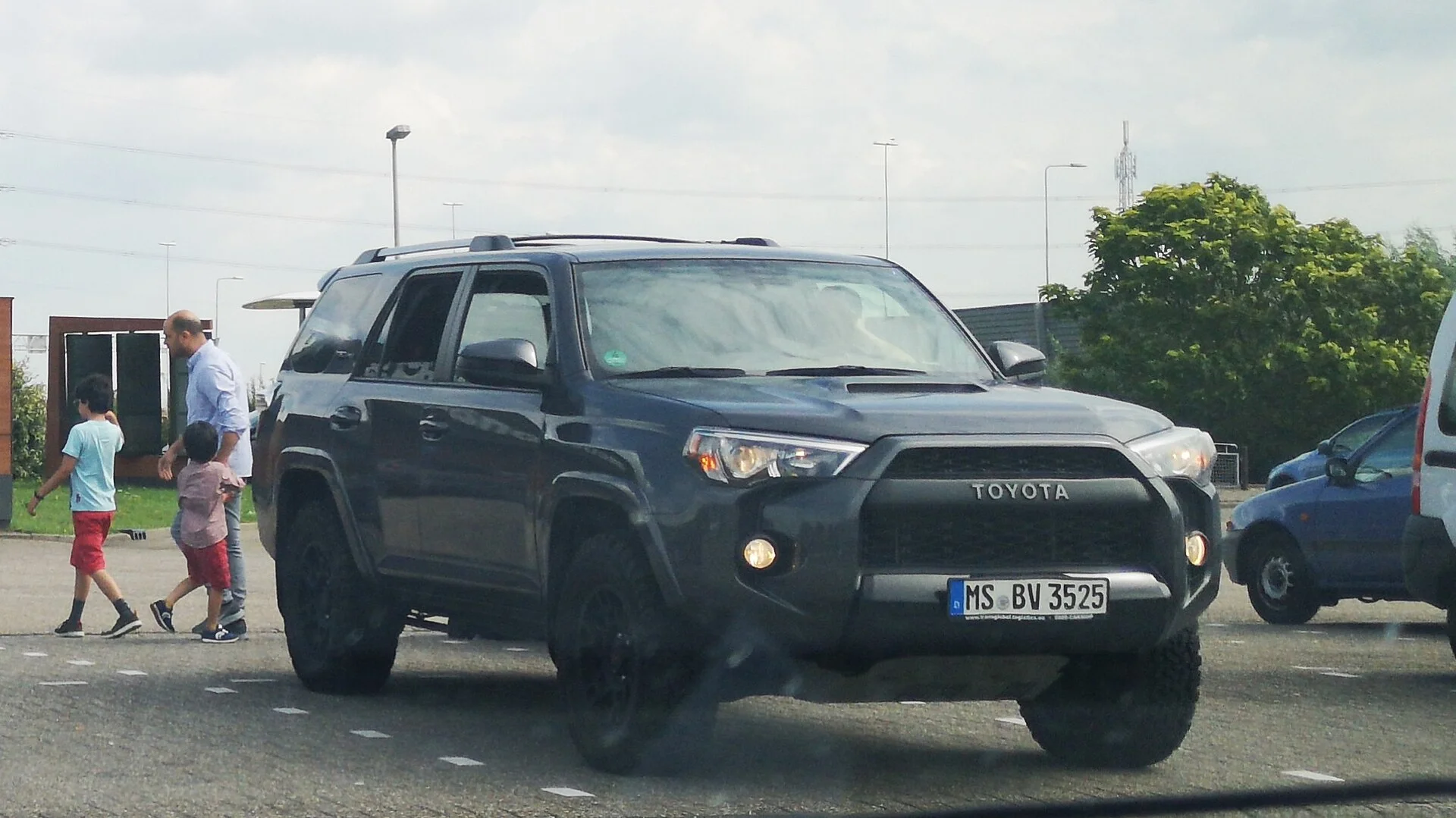 Toyota 4Runner TRD — a black 4Runner, front three-quarter view