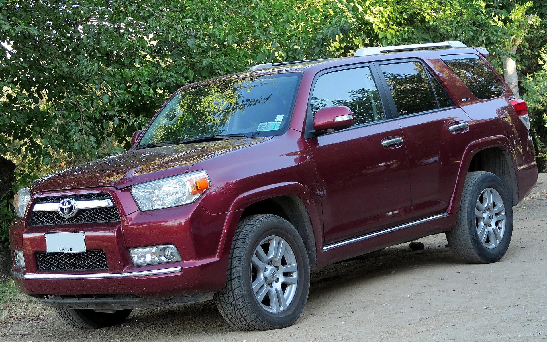 Toyota 4Runner Limited — a maroon 2012 4Runner, front three-quarter view