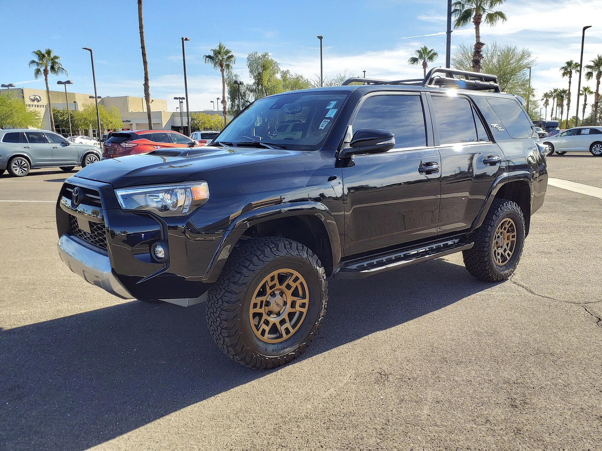 Toyota 4Runner TRD Off-Road — a dark-blue 2022 4Runner, front and side three-quarter view