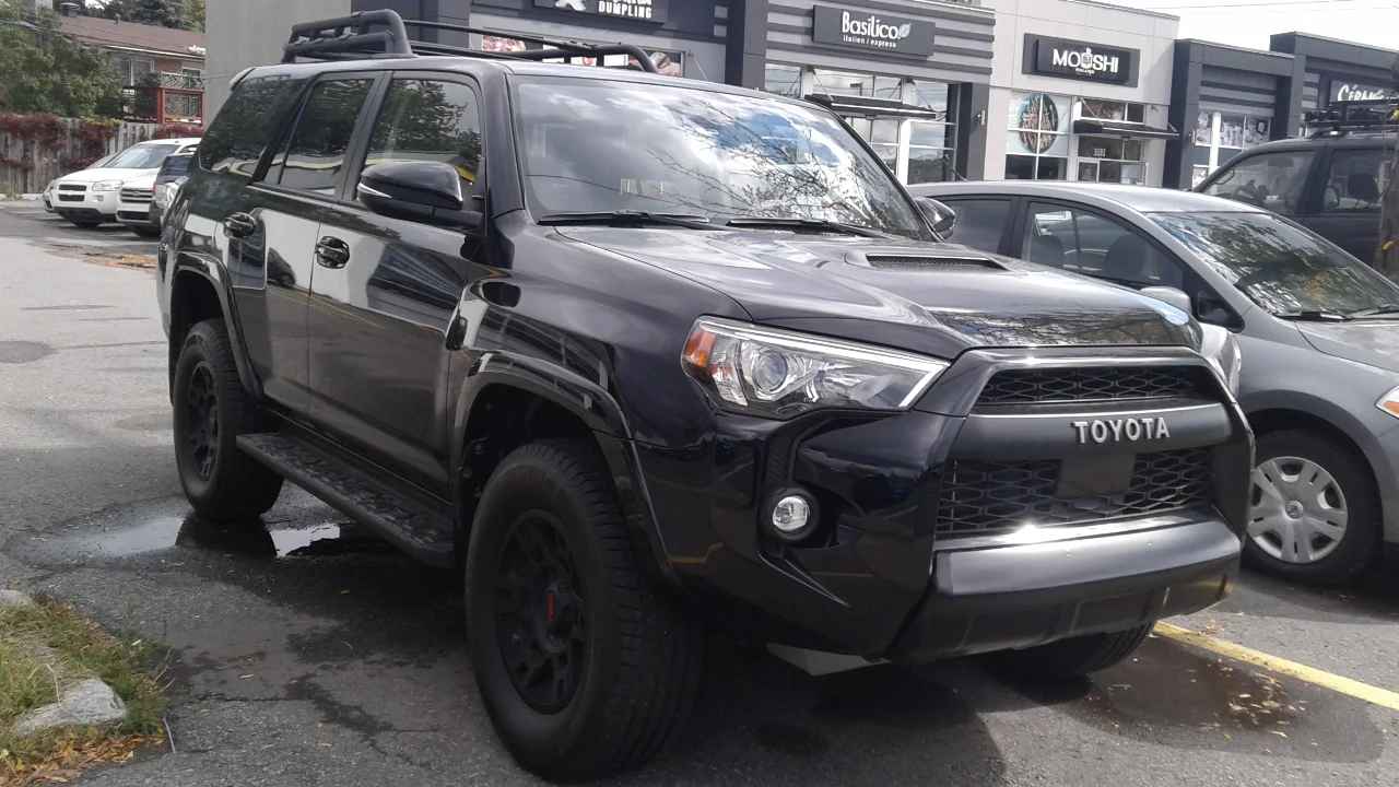 Toyota 4Runner TRD — a black 4Runner, front three-quarter view