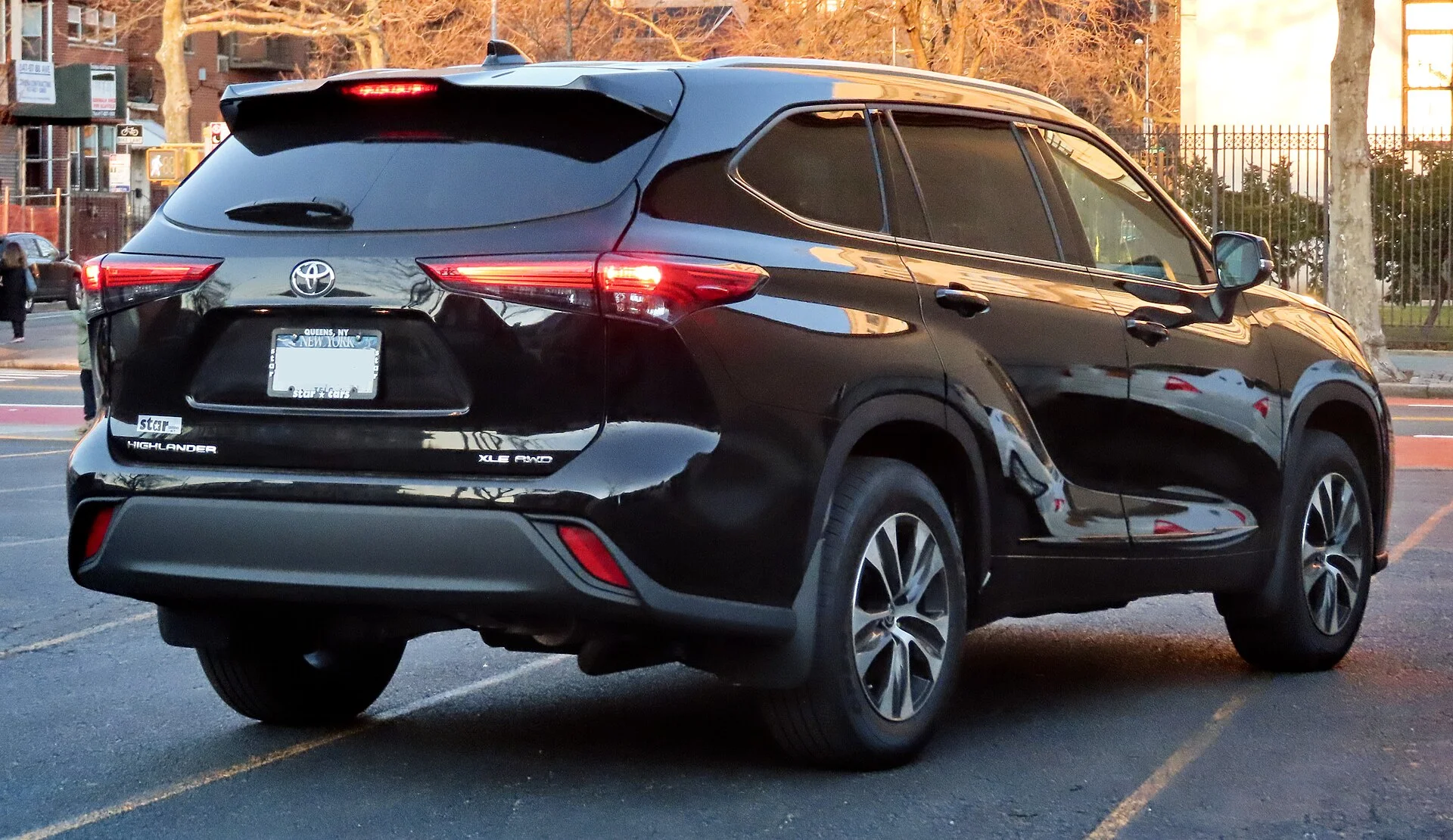 Toyota Highlander XLE — a black 2020 Highlander, rear three-quarter view