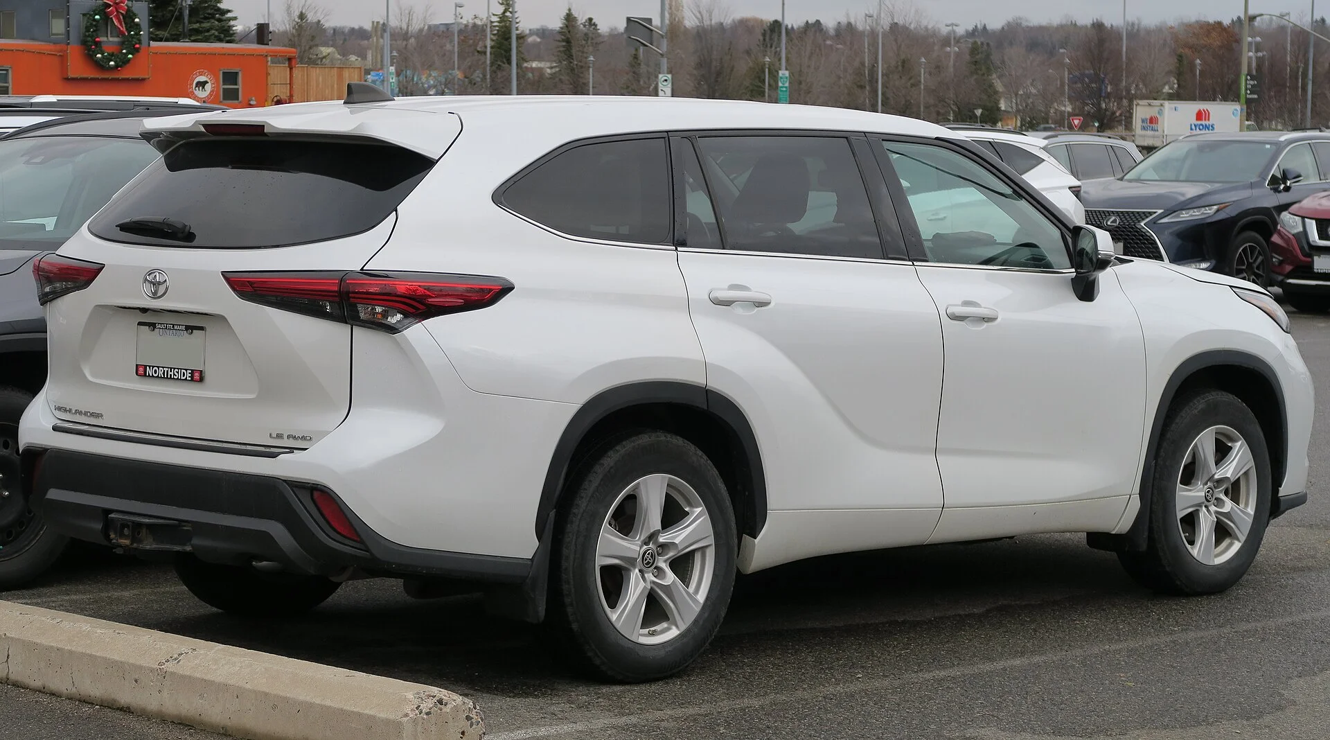 Toyota Highlander LE — a 2022 Highlander, rear three-quarter view