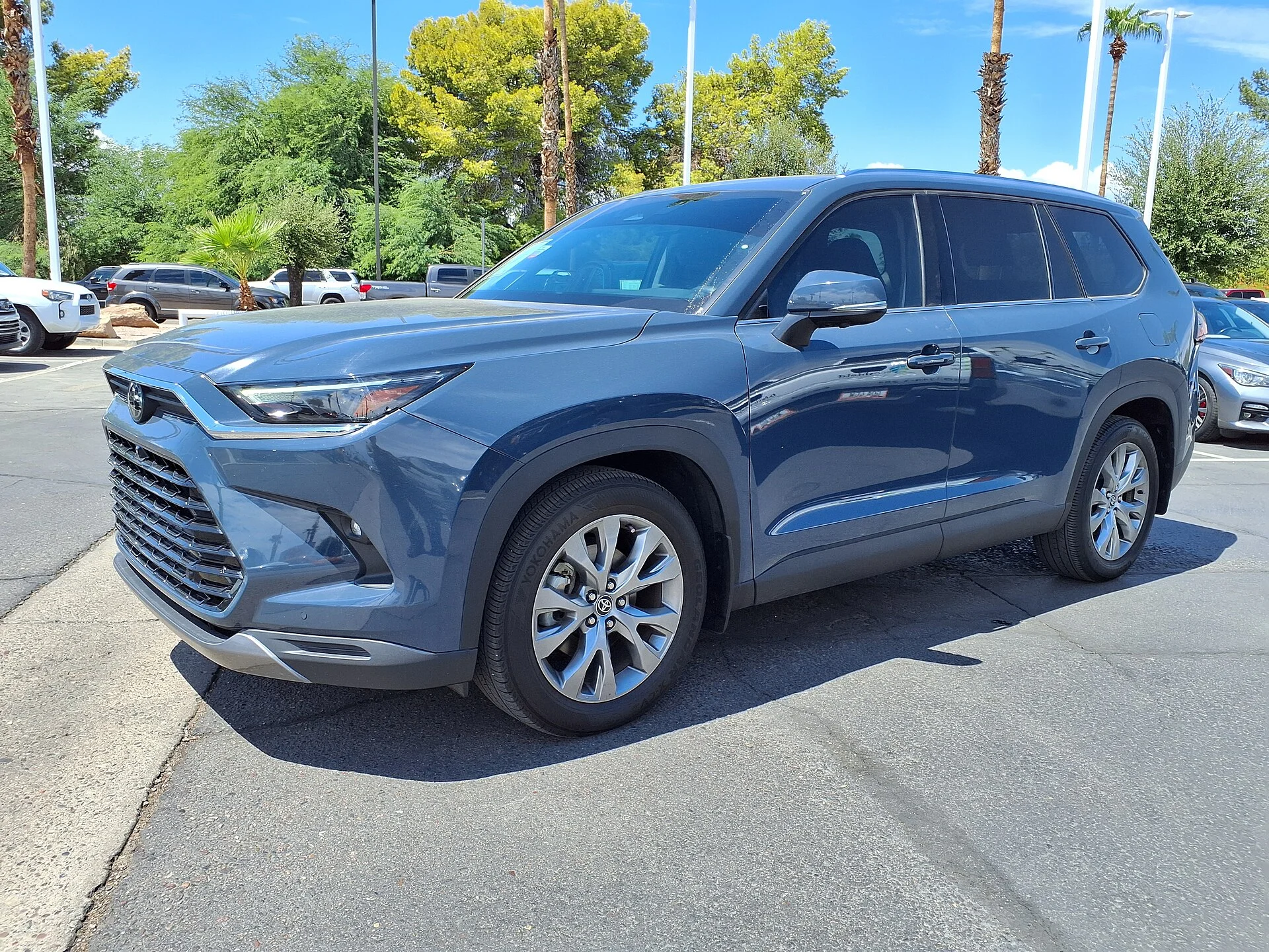 Toyota Grand Highlander (2024) in blue, front three-quarter view