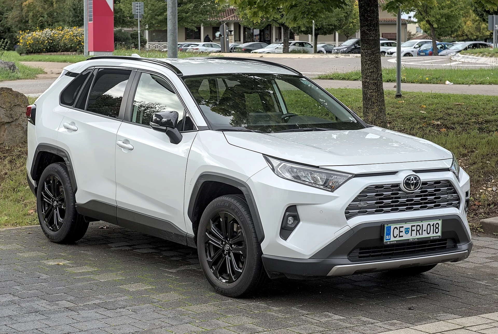 Toyota RAV4 (XA50) front three-quarter, the compact SUV platform this camping build starts from