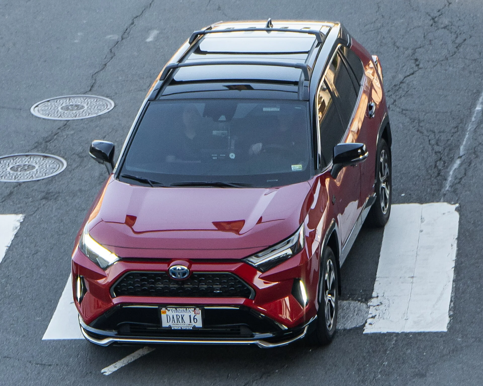 Toyota RAV4 (XA50) from above showing the factory roof rails used for a roof rack or rooftop tent