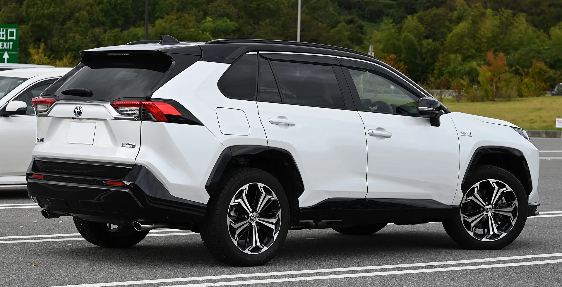 White Toyota RAV4 hybrid, rear view