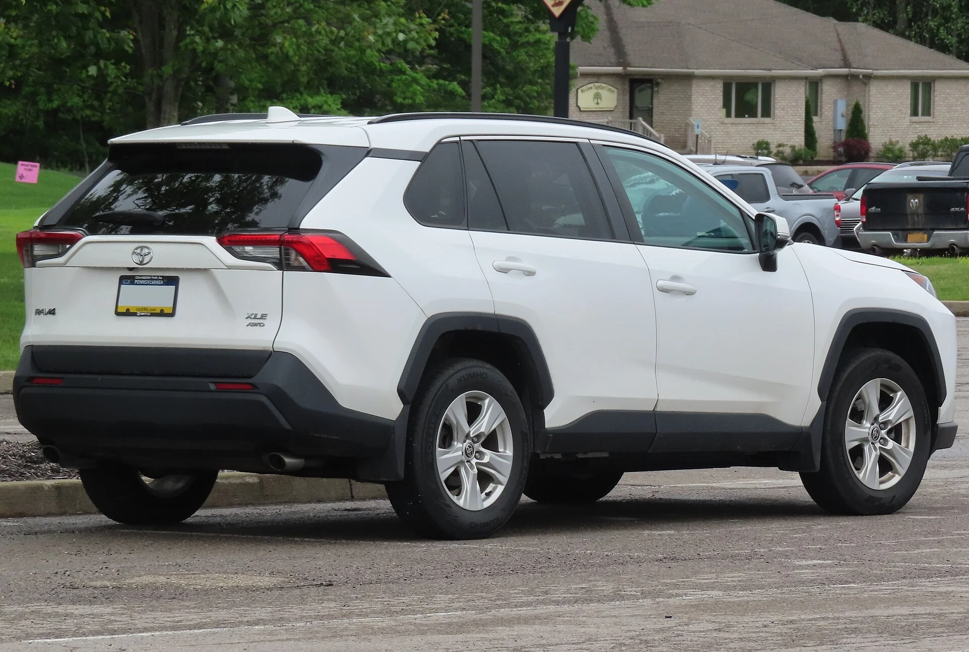 White Toyota RAV4 XLE, rear right where a hitch receiver mounts