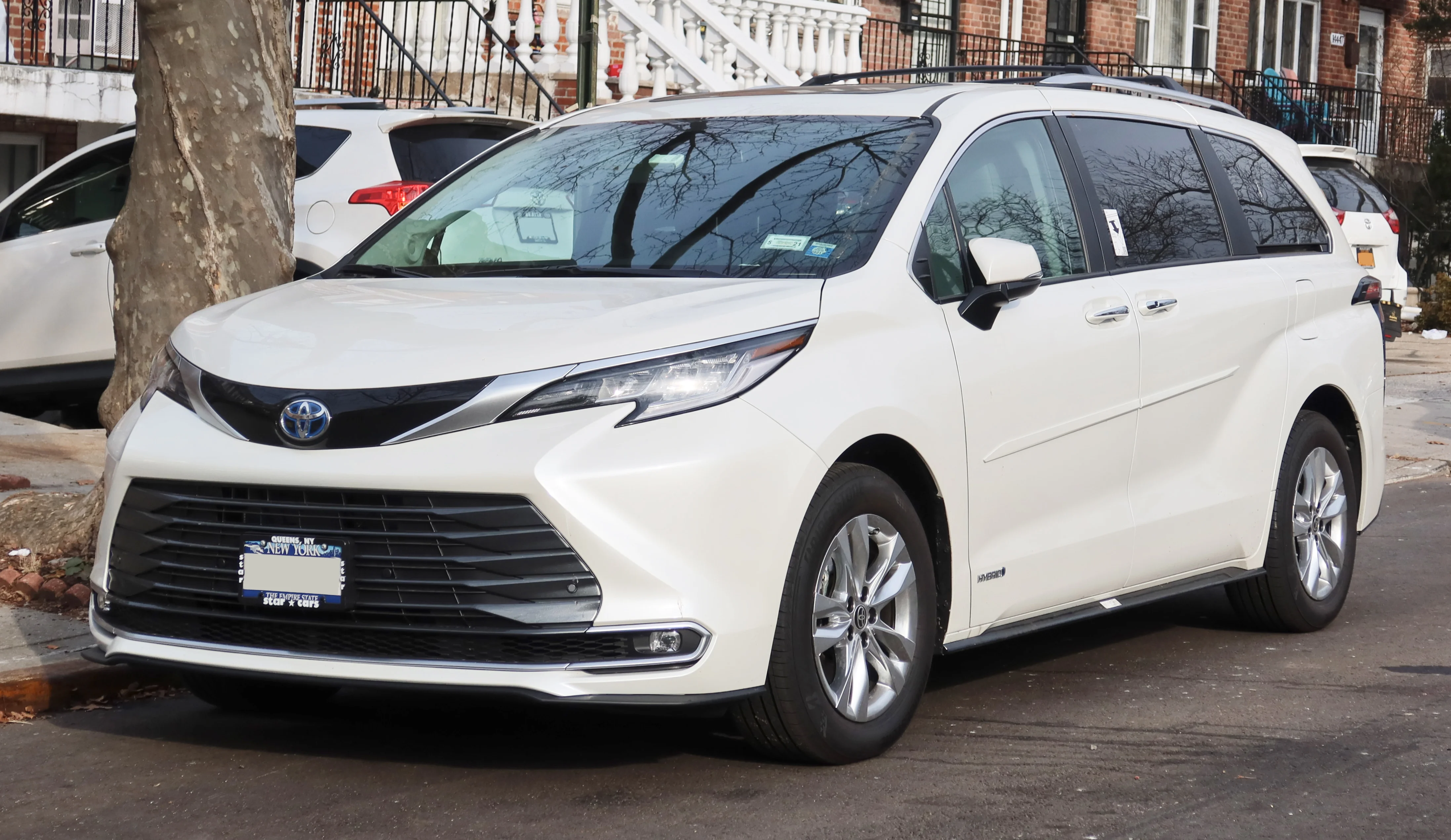 A 2021+ Toyota Sienna (XL40) front three-quarter, the redesigned hybrid minivan this sleep plan is built around