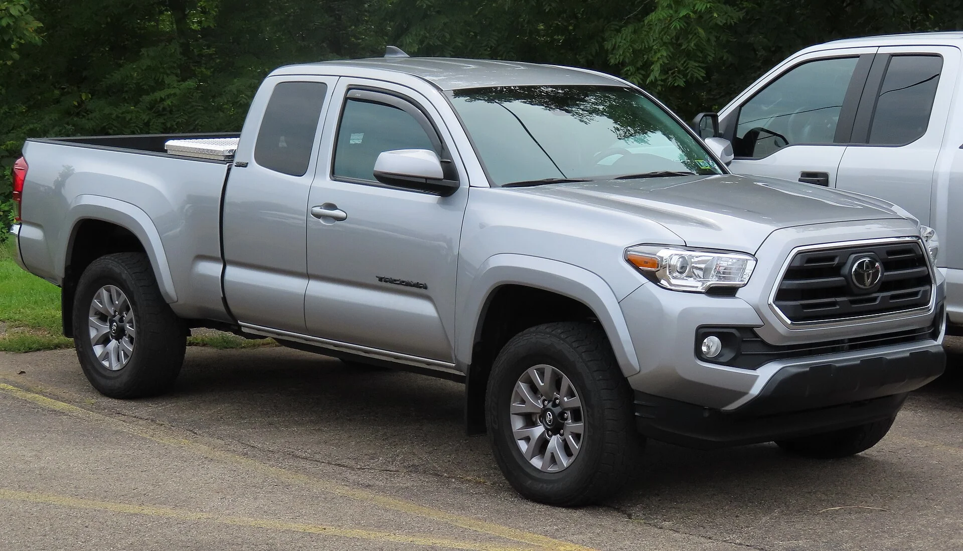 Toyota Tacoma SR5 — a silver 2019 Tacoma, front three-quarter view