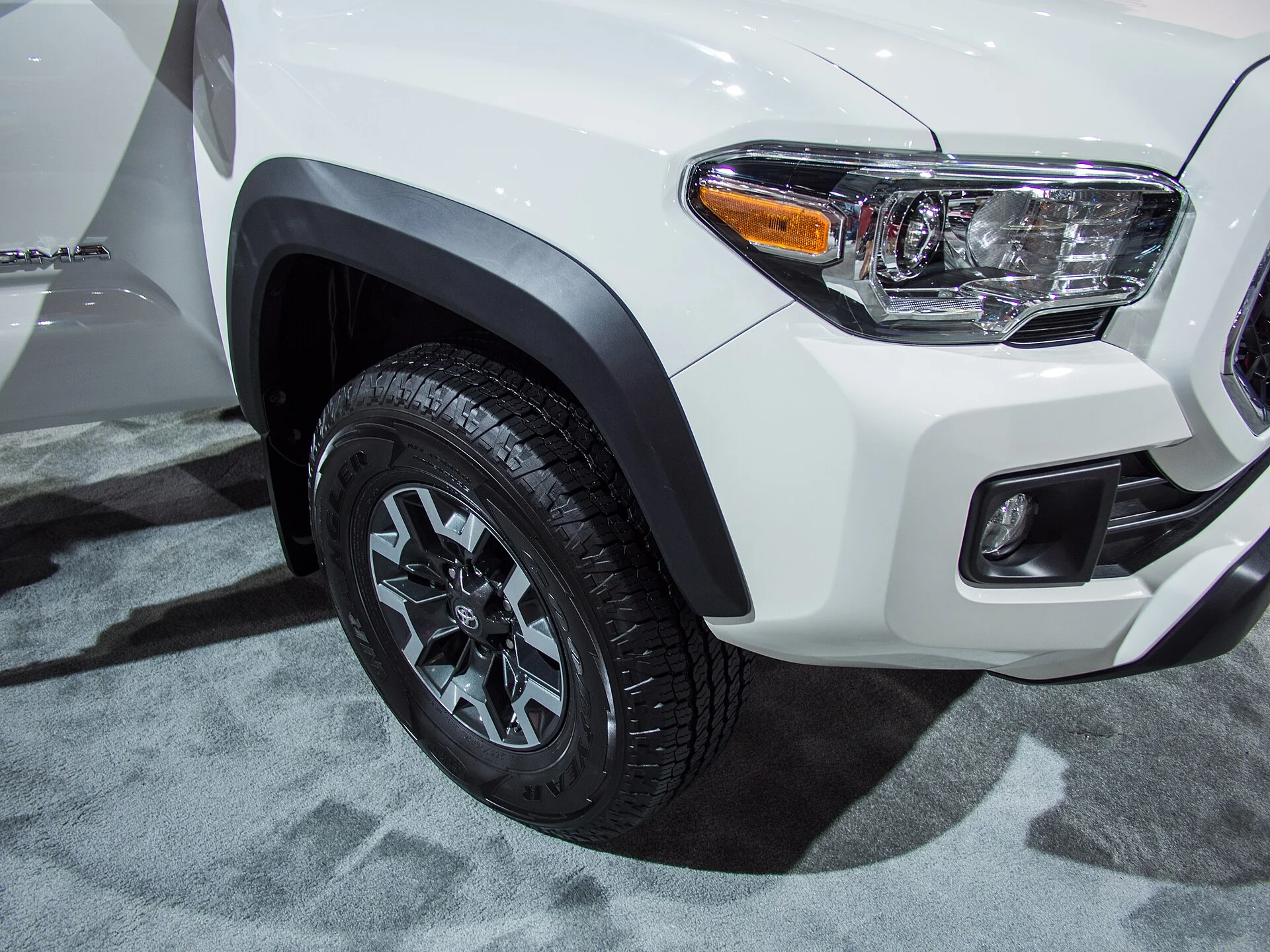 Toyota Tacoma — a white Tacoma, front three-quarter view