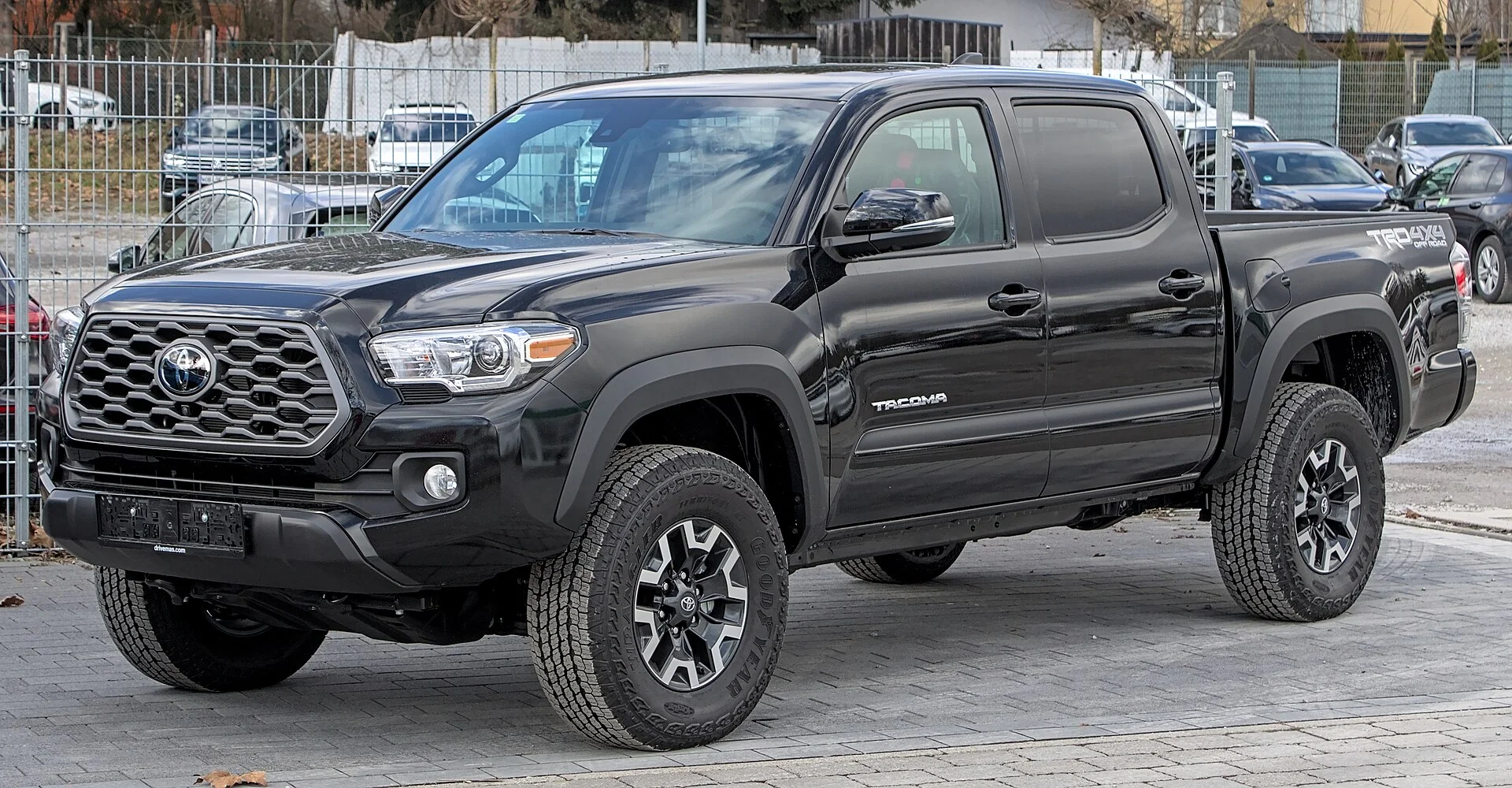 Black Toyota Tacoma TRD pickup, front three-quarter view (2020)