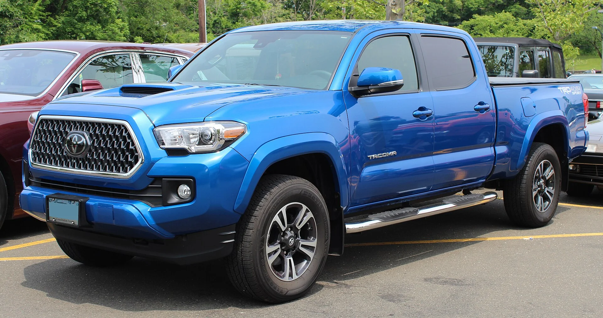 Blue Toyota Tacoma TRD Sport double cab, front side view (2018)