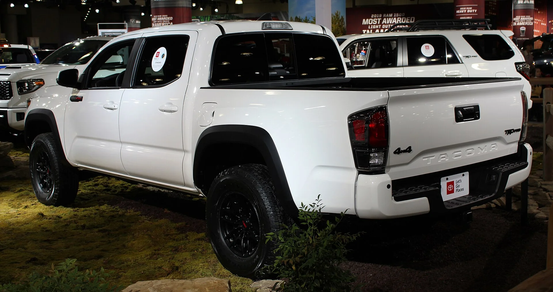 White Toyota Tacoma TRD Pro rear view with a bed topper (2020)