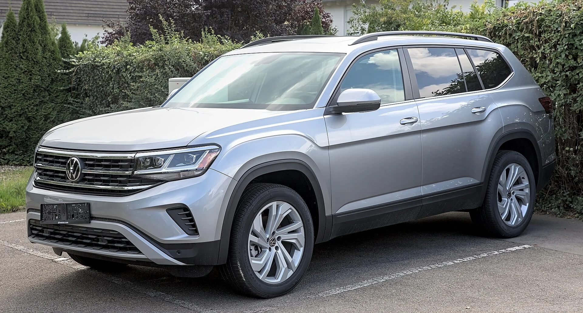 Volkswagen Atlas front three-quarter, the full-size SUV whose folded floor makes the bed