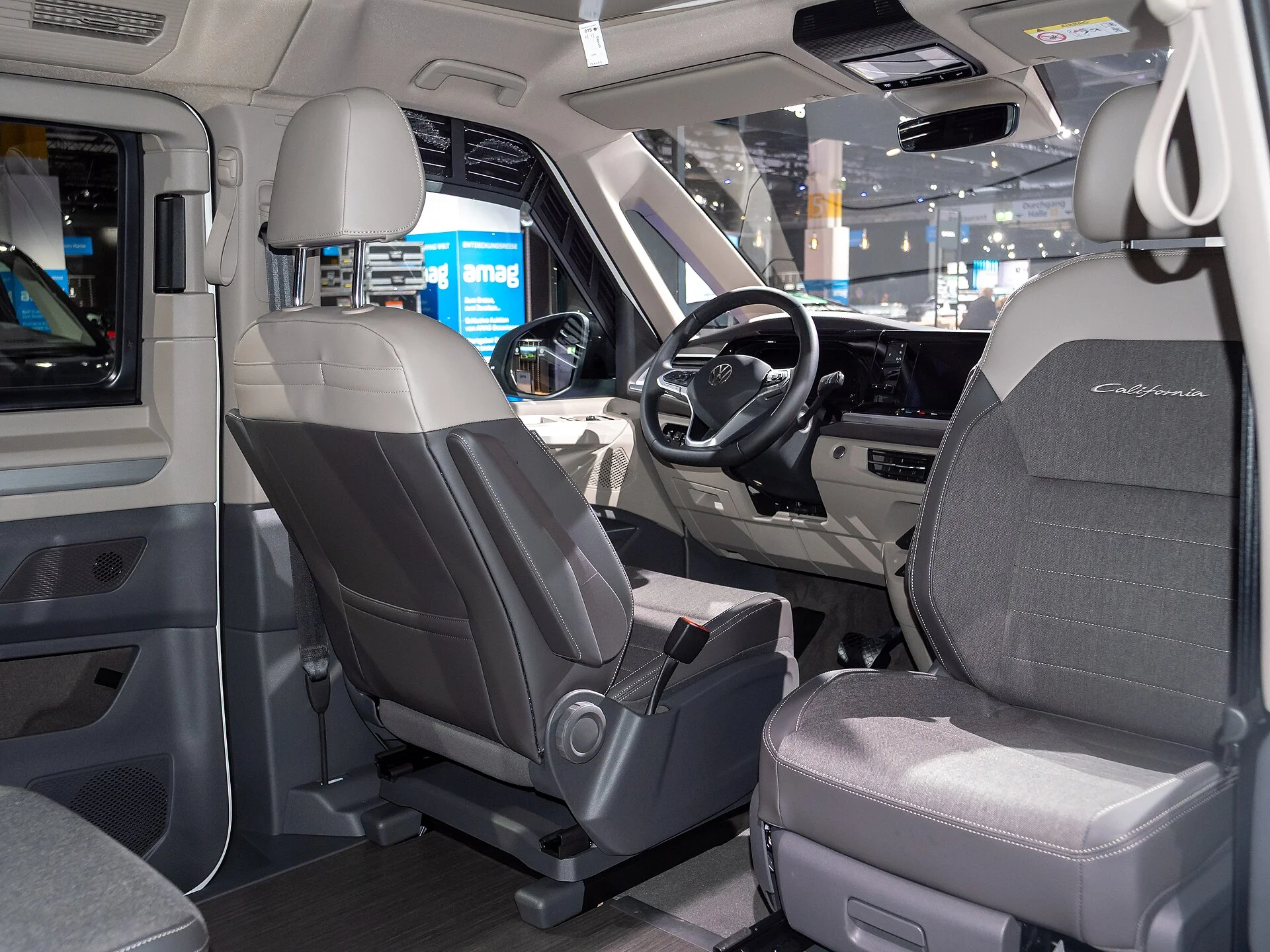 A Volkswagen California cabin with swivel front seats, showing the interior living space this review measures