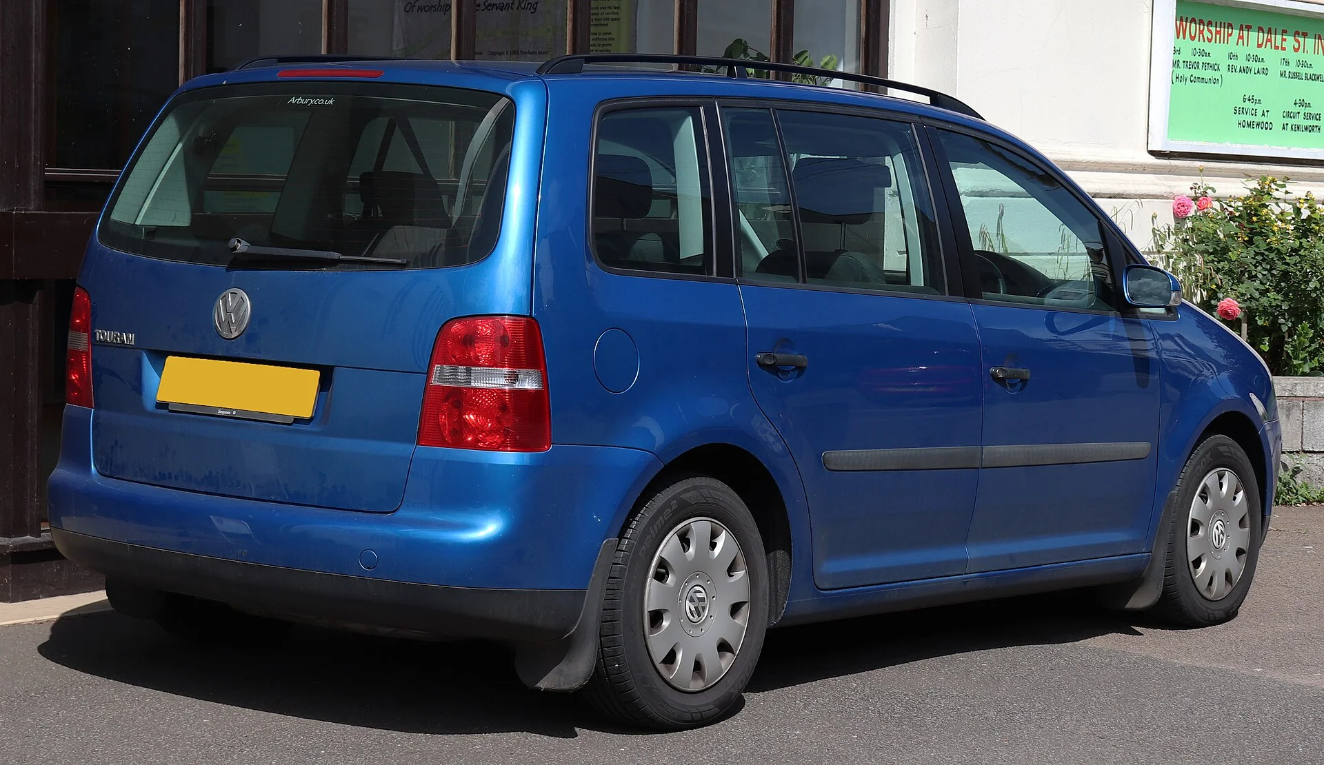 An earlier-generation VW Touran compact MPV (rear view); the current Touran shares this compact people-mover layout this car camping guide discusses.